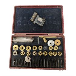 Clock makers lathe accessories, in fitted case, inscribed Accessories Pour Outil A Arrondir, together with a miniature reflecting level