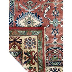 Afghan Yakash Kazak, pale ground field decorated with plant motifs, repeating border with stylised motifs