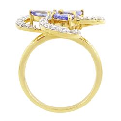 18ct gold tanzanite and diamond cluster ring, three pear cut tanzanite's, with round brilliant cut diamond surround, in an openwork swirl setting, hallmarked, total tanzanite weight 1.50 carat, total diamond weight 0.55 carat, with World Gemological Institute Report