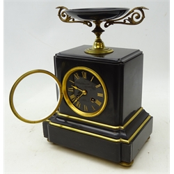  19th century French black slate mantel clock, dial with black Roman numerals indistinctly inscribed, twin train movement striking the half hours on a bell stamped 670, case surmounted with a tazza and with brass bezel, mouldings and feet, H30cm, W22cm, D15cm  