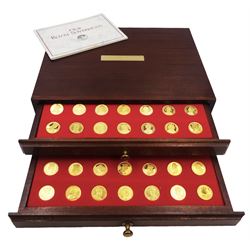Danbury Mint, Our Royal Sovereigns Collection, seventy 22 carat gold plated silver medallions depicting the complete line of British monarchs to mark the 1200th anniversary of the first coronation, contained within wooden table top collectors cabinet with two drawers, with certificate of authenticity, with two drawers, hallmarked Danbury Mint, London various dates
