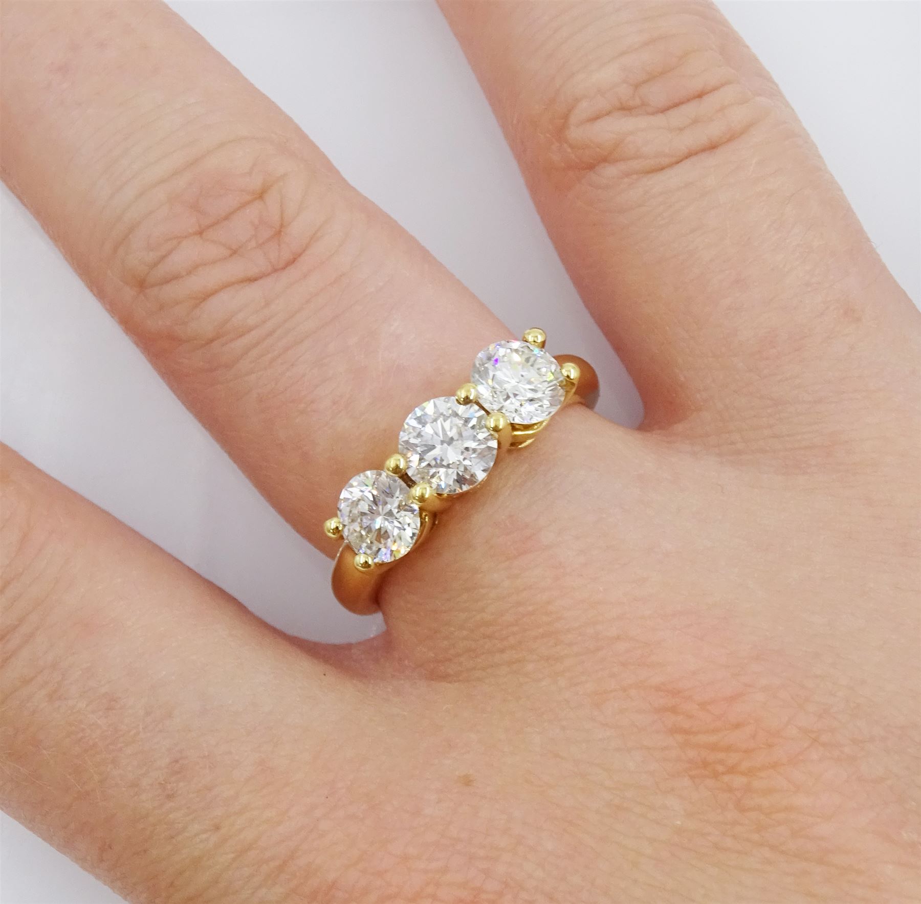 18ct gold three stone round brilliant cut diamond ring, hallmarked, total diamond weight approx 1.80 carat