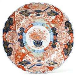 Japanese Meiji period imari charger, painted centrally with vase and floral bouquet, surro...