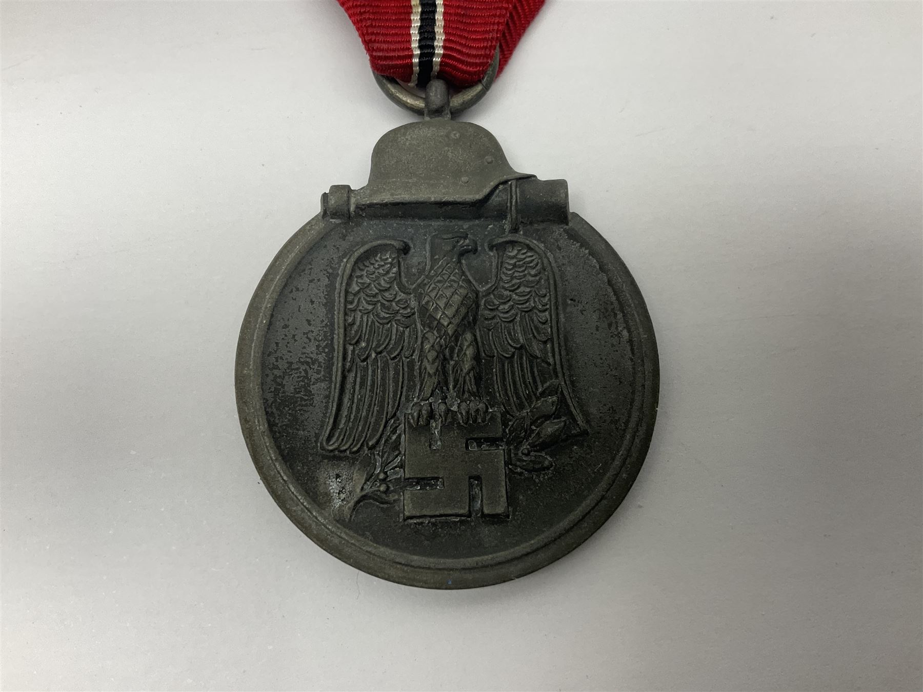 WWII German 'SS' Long Service Medal for four years; Ostfront Medal for the Winter Campaign in Russia of 1941-1942 'Die Medaille Winterschlacht Im Osten'; and War Merit Cross 2nd Class with swords; all with ribbons (3)