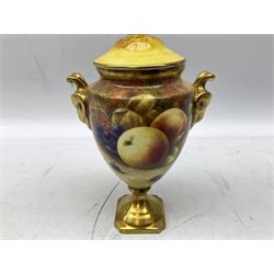 Coalport vase and cover with twin gilt rams head handles, hand painted by Richard Budd with a study of fruit upon a mossy ground, signed, with printed marks beneath, H17.5cm
