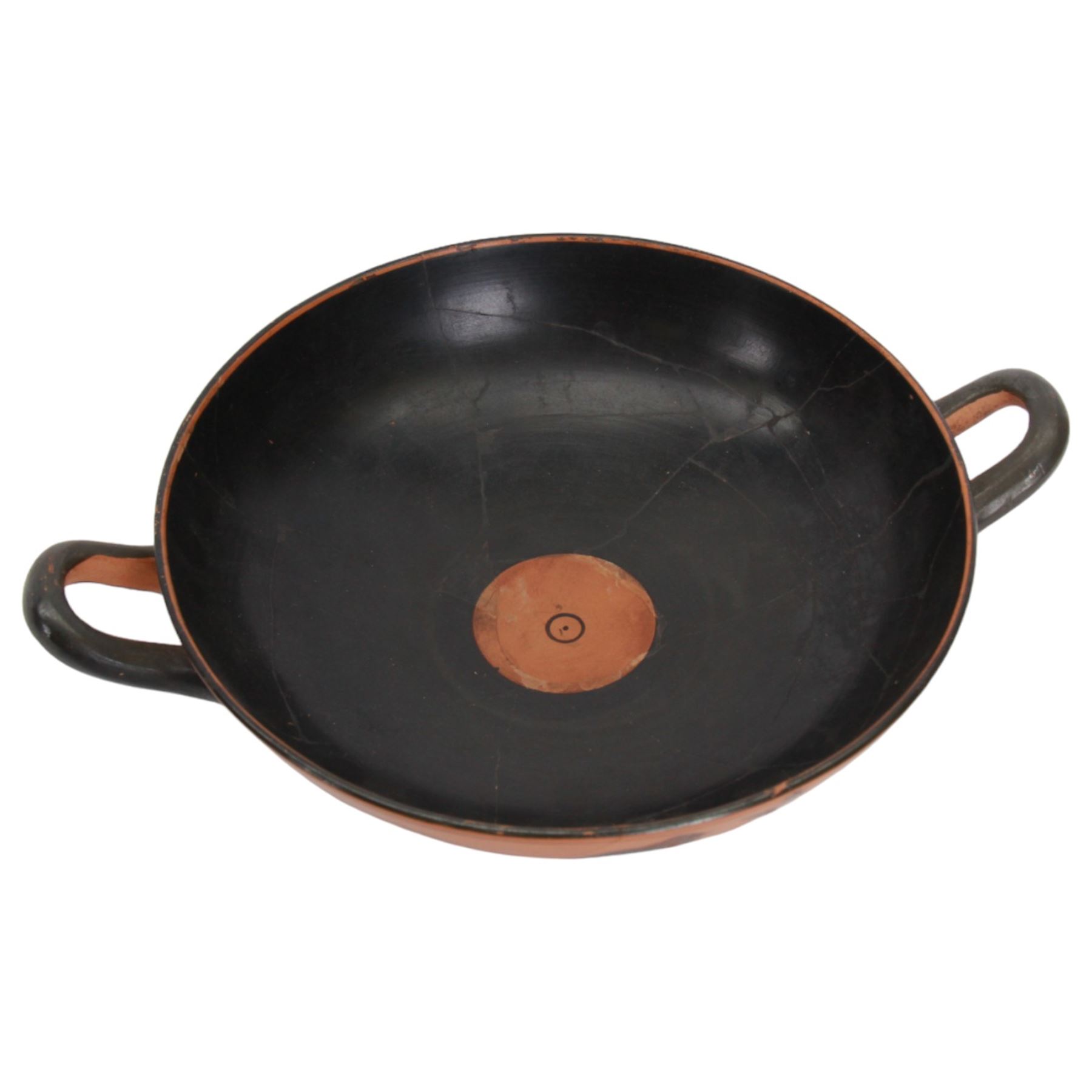 Greek Attic Black-figured eye cup, of typical form with twin handles, the exterior painted with erotic figures flanked by apotropaic eyes, the black interior with reserved tondo with ring dot motif, upon pedestal foot, including handles H9.5cm W28.5cm cup D21.5cm

