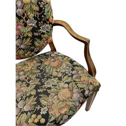 Pair of George III mahogany framed open armchairs, oval back and serpentine seat upholstered in fruit and foliage patterned fabric, shaped and moulded arms and arm supports, on square tapering moulded front supports 