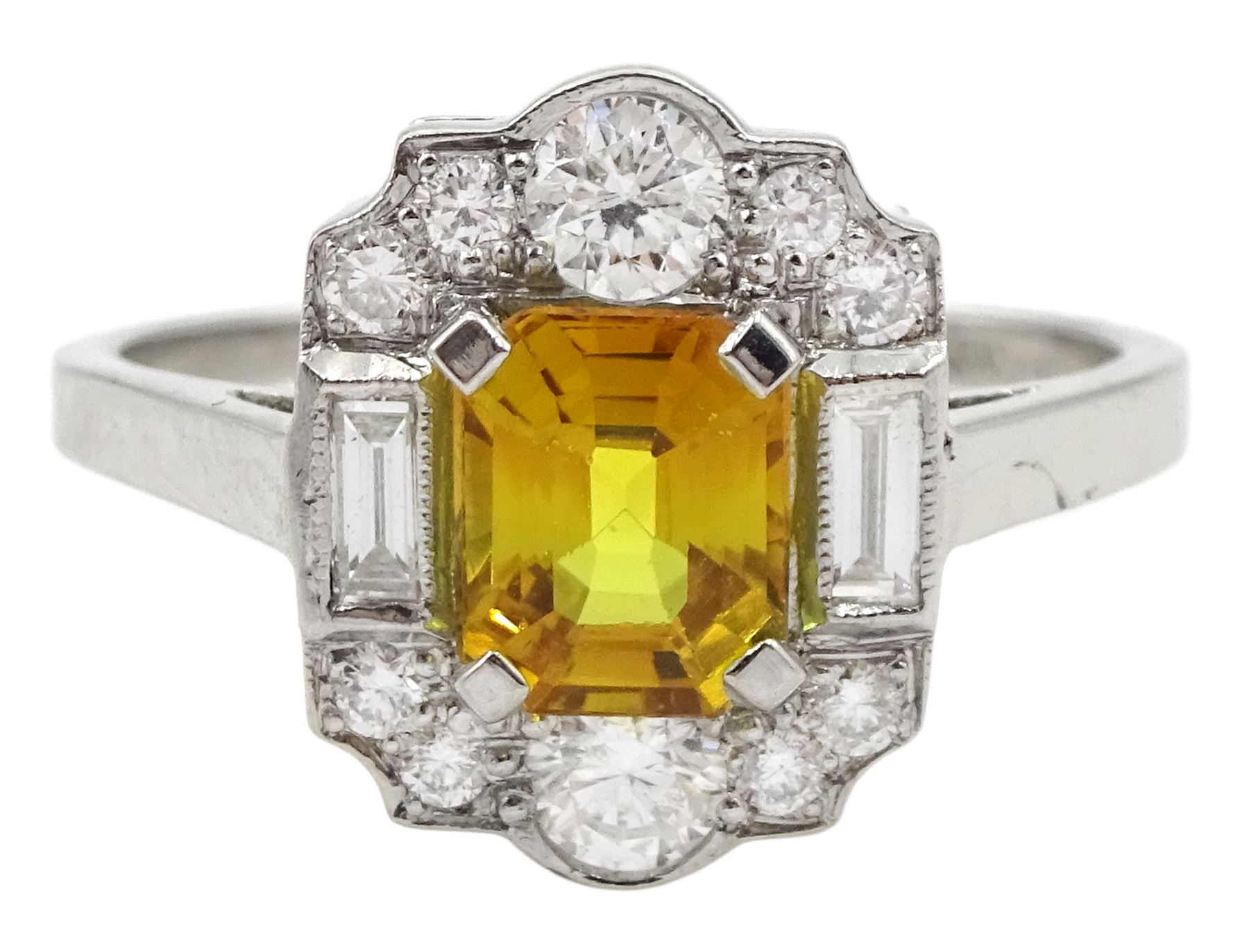 Platinum emerald cut yellow sapphire, baguette and round brilliant cut diamond cluster ring, stamped Plat, sapphire 1.30 carat, total diamond weight 0.55 carat, with World Gemological Institute Report