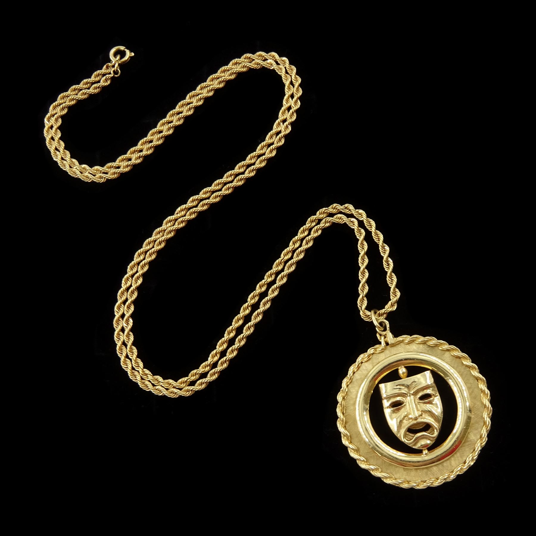 Gold swivel comedy tragedy mask pendant, stamped 14K, with rope twist border, on gold rope twist chain necklace