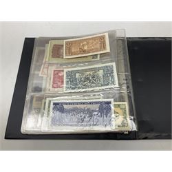 World banknotes, including Queen Elizabeth II The States of Jersey one pound 'DB202703', five pounds 'BB527762' and ten pounds 'AB651481', reserve bank of New Zealand two dollars '1L3 741894', King George V Straits Settlements one dollar 1st January 1935 'F/83 28924', various Bank of England notes etc, housed in two ring binder albums