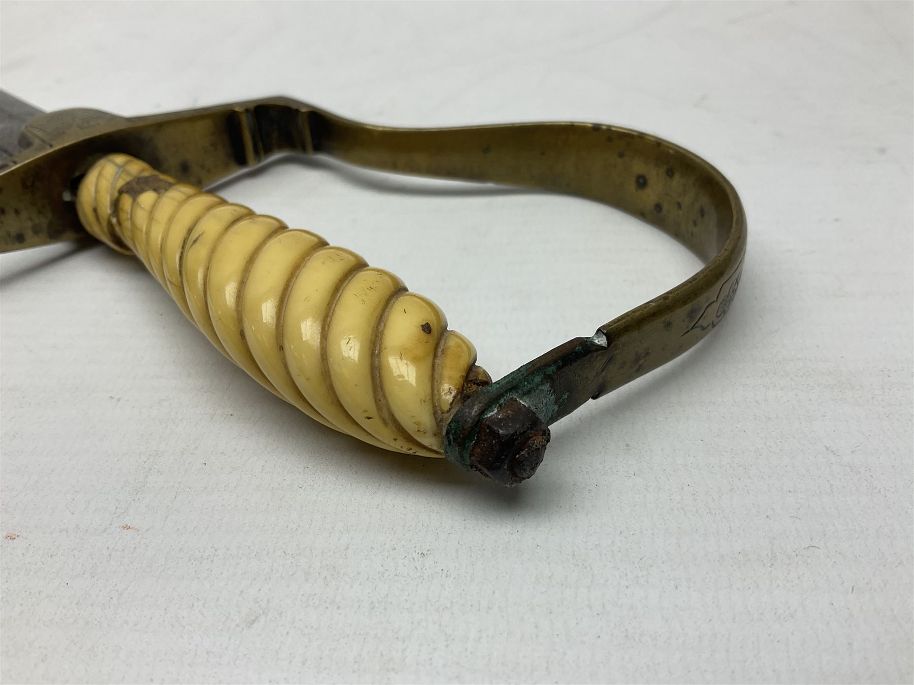 1900-1918 German Imperial NCO sabre with WW2 modifications of Wehrmacht insignia to the langet, 79cm slightly curving fullered blade and brass hilt, the knucklebow chased with oak leaves and acorns L90.5cm overall
This item has been registered for sale under Section 10 of the APHA Ivory Act 