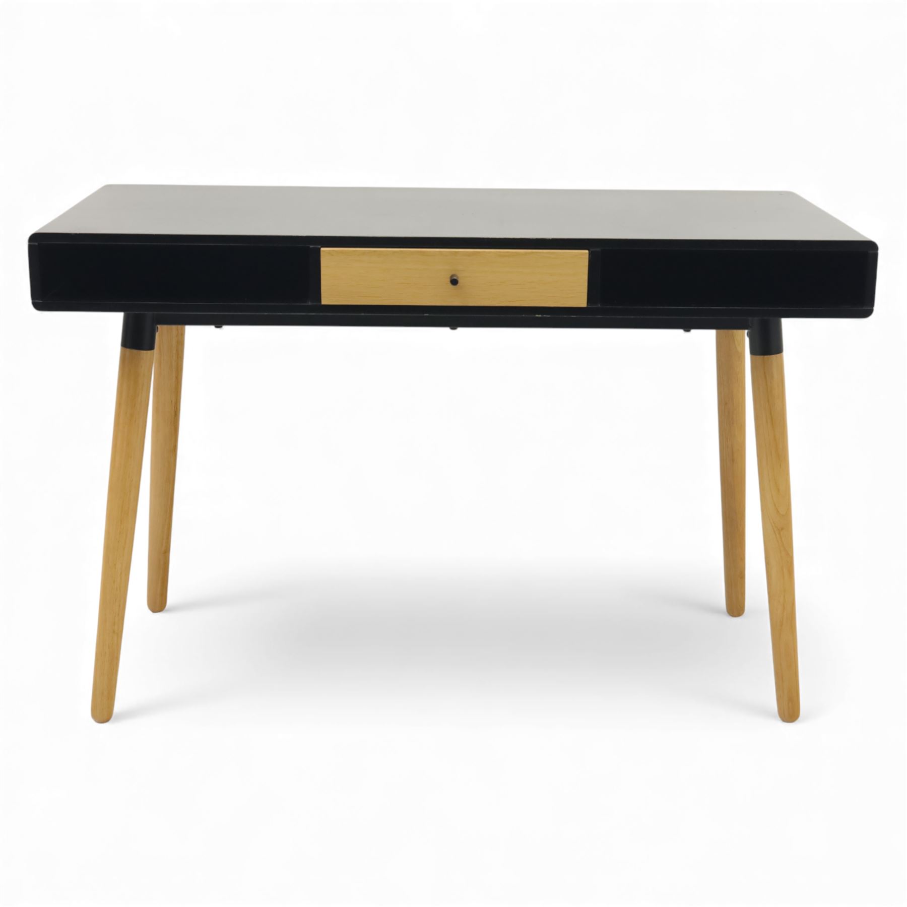 Modern black single drawer desk, black rectangular top above a single oak veneered drawer with black metal pull, flanked by two open shelves raised on tapering oak veneer legs (From floor to underside 64cm)