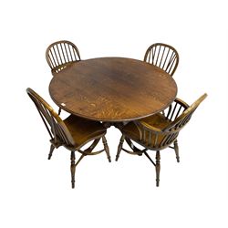 Figured oak dining table, circular moulded top on turned pedestal with four splayed supports with spade feet, together with four Windsor chairs, two armchairs and two sidechairs, all on turned supports with crinoline stretchers
