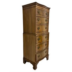 Burton Reproductions walnut chest on chest, fitted with six serpentine drawers