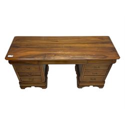 French cherry wood kneehole desk or dressing table, moulded rectangular top over twin pedestal bases each housing three drawers with brass-effect swing handles, resting on bracket feet
