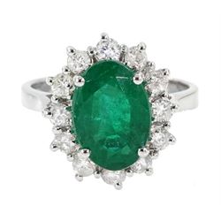 18ct white gold oval emerald and diamond cluster ring, hallmarked, emerald approx 2.40 carat, total diamond weight approx 0.60 carat