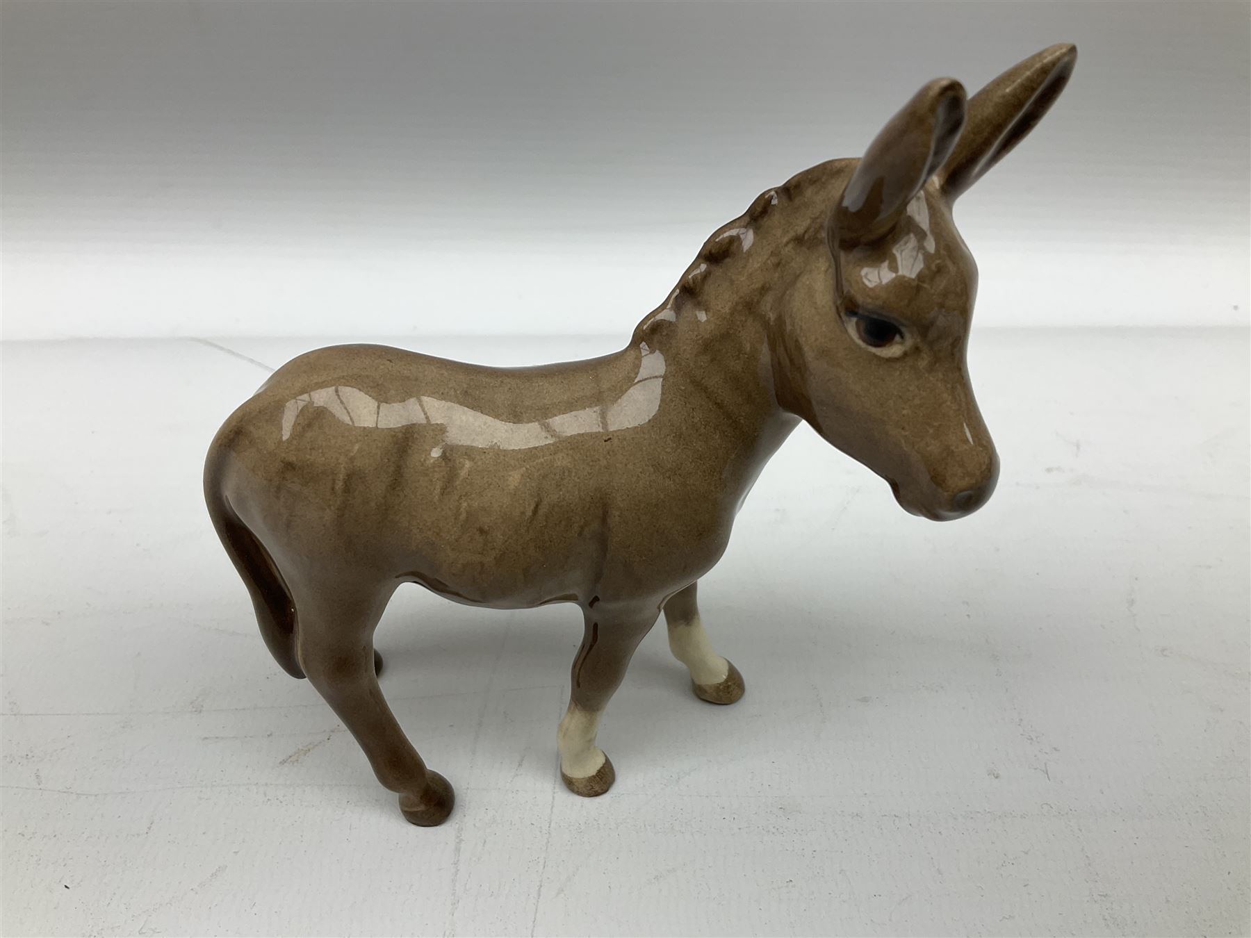 Beswick donkey family to include no.1364b, no.2267a, another donkey and donkey foal (4)