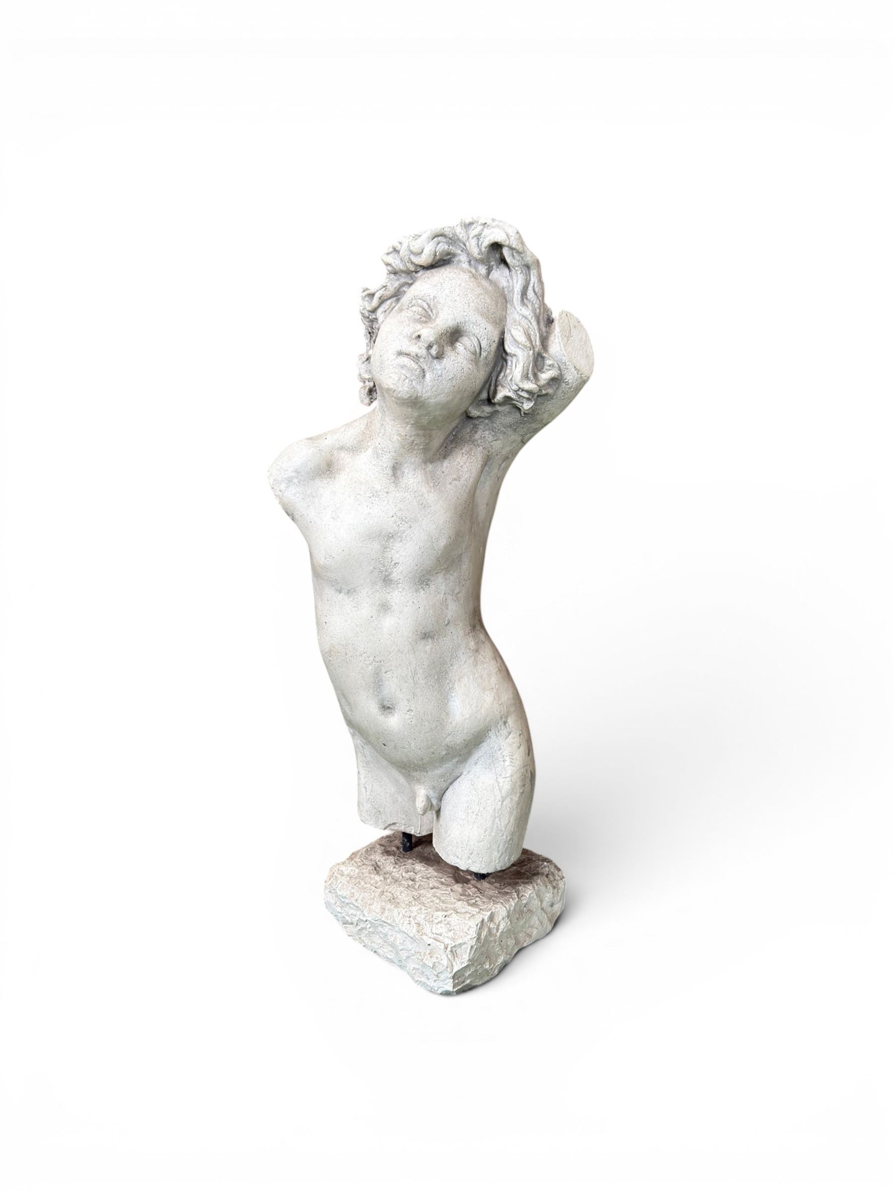 Early 20th century sculptured painted plaster figure of a boys torso, raised on 'stone' plinth