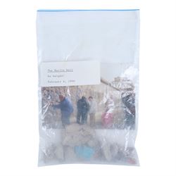 Fragment of the Berlin Wall, largest piece with blue paint to one side, with photograph an...