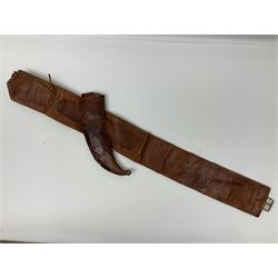 Late 19th century Yemeni Tuza jambiya as worn by religious elite, the 20.5cm curving blade with raised medial ridge, the horn hilt with pique style studwork, in a leather wrapped wooden scabbard with pierced metal mount and leather belt applied with embroidered 'gold' and 'silver' thread work panel; dagger L36cm overall, belt L84cm