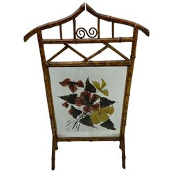 Victorian bamboo fire screen, pointed arched cresting rails over floral painted glass panel 