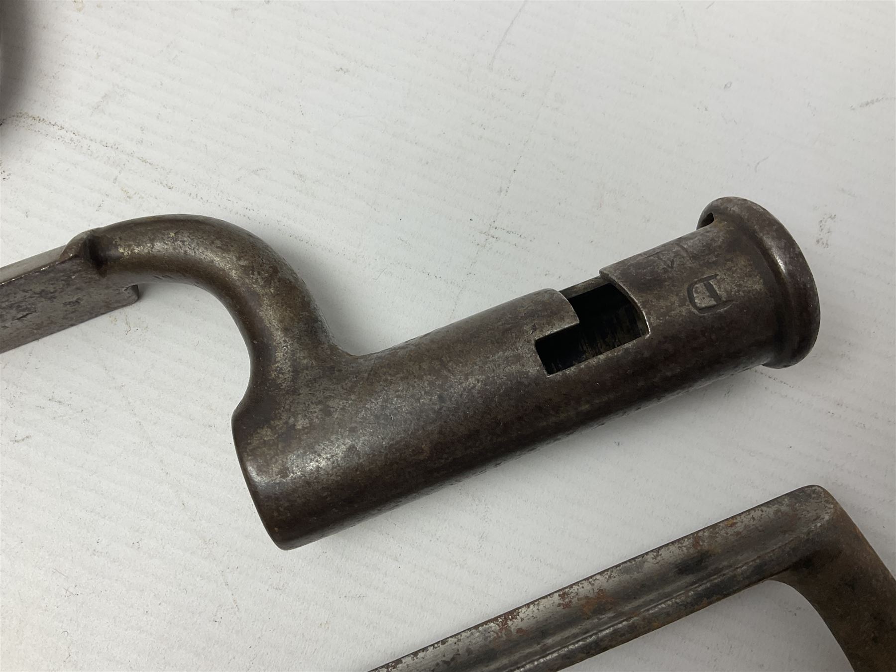Early 19th century British Brown Bess musket rifle socket bayonet with zigzag fitting stamped D71 and triangular blade stamped 270 L55cm overall; and two other 19th century socket bayonets; no scabbards (3)