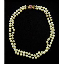 Double strand cultured pearl necklace, with 9ct gold ruby clasp, which is detachable to form two single strands