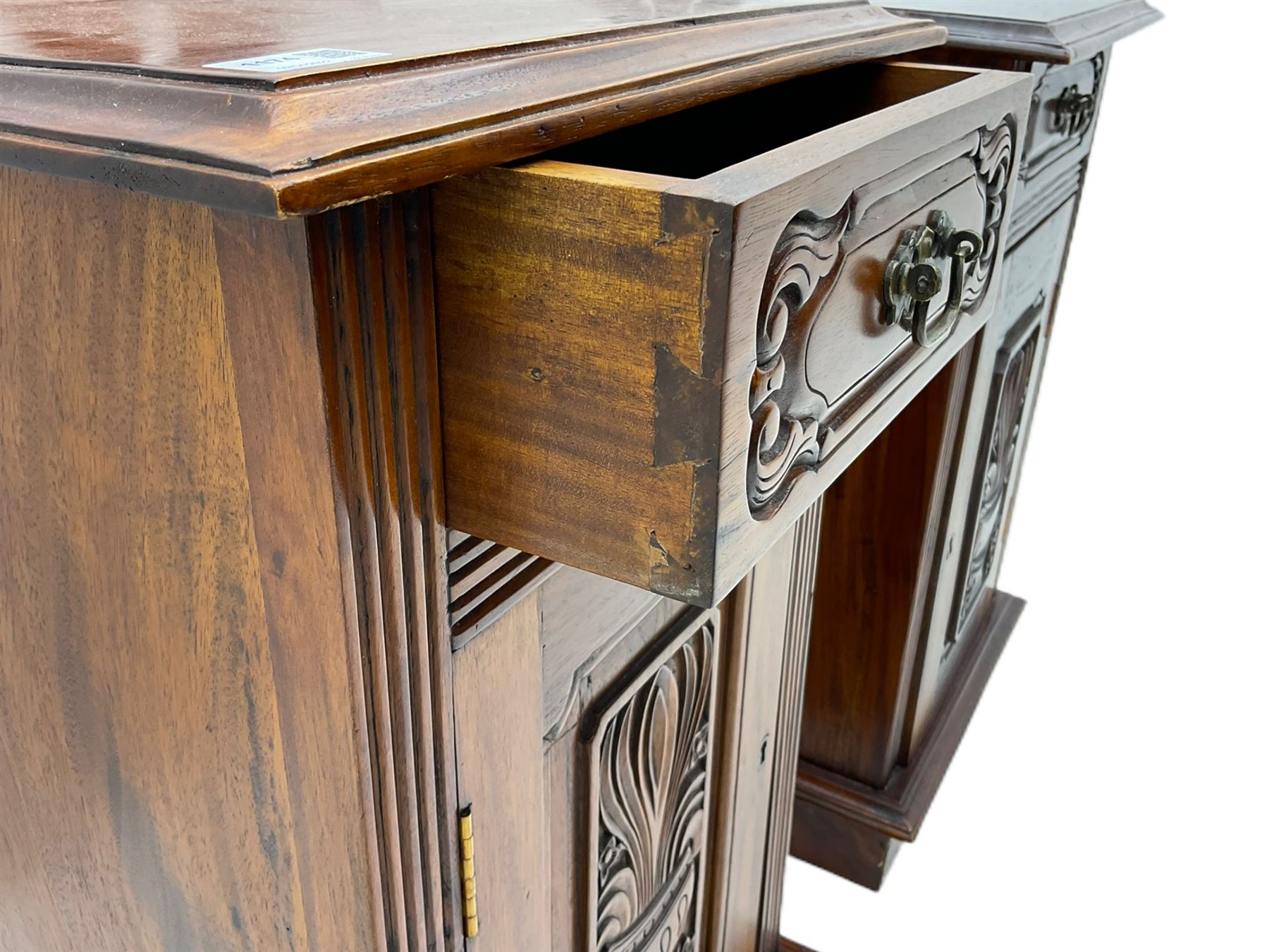 Pair Victorian style hardwood bedside cabinets, fitted with single drawer and cupboard, the doors carved with floral urns, on plinth bases