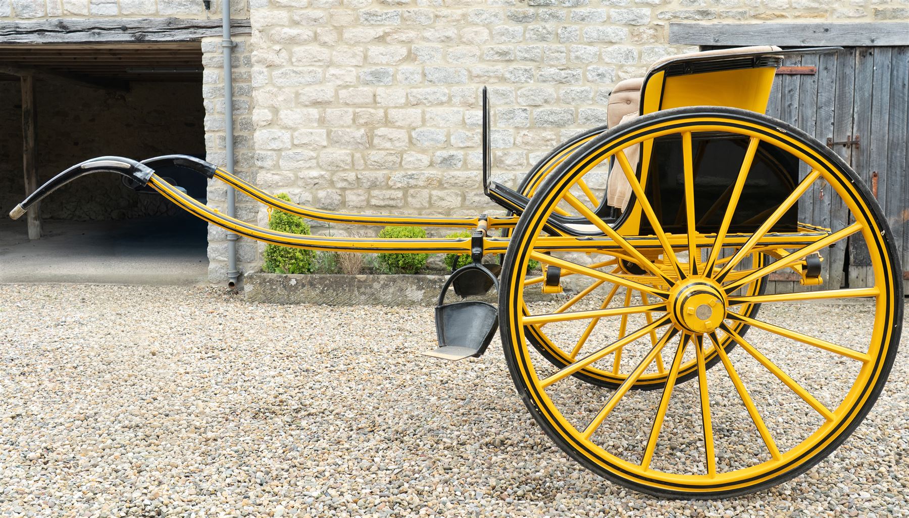 Victorian Two Wheeled Pleasure Driving Round Back Gig by Shanks of London

A Victorian two wheeled pleasure driving round back gig, painted in black and yellow, with upholstered forward facing seat for two, panelled dashboard, wooden spoked wheels, iron step and shafts for a single horse. The vehicle is fitted with a rear luggage compartment and mounted on elliptic springs.

Features
• Black and yellow painted body
• Upholstered forward facing seat
• Panelled dashboard
• Rear luggage compartment
• Wooden spoked wheels
• Iron step
• Elliptic spring suspension
• Shafts for a single horse

Dimensions:
Overall length: 310 cm
Width: 160 cm
Body width: 82 cm
Height: 160 cm

Wheel Diameters:
Wheels: 138 cm

Seating:
Driver and passenger: 2