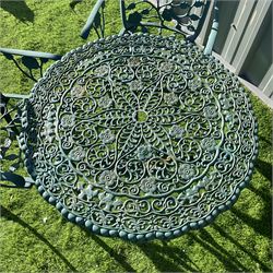 Cast aluminium garden table and four chairs painted in green  - THIS LOT IS TO BE COLLECTED BY APPOINTMENT FROM DUGGLEBY STORAGE, GREAT HILL, EASTFIELD, SCARBOROUGH, YO11 3TX