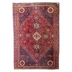 Qashqai wool carpet, red diamond-shaped field decorated with three stepped pole medallions...