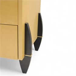 Contemporary maple veneered sideboard, serpentine glass top over six graduating Blum soft-close drawers, raised on curved black and gilt accented supports