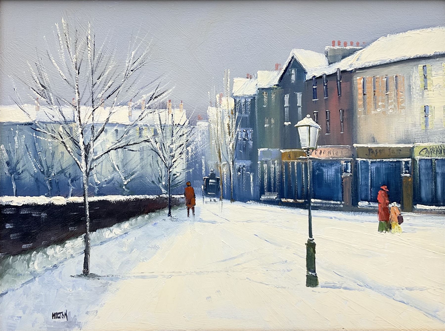 Barry Hilton (British 1941-): Snowy Winter Street Scene, oil on canvas signed 29cm x 39cm