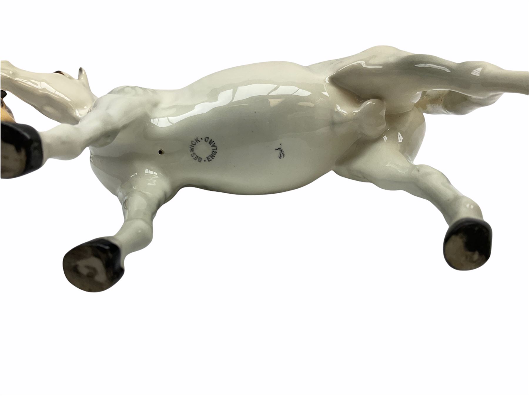 Beswick horse figures, comprising Highland Pony 1644, and another, probably Aran Bahram in grey, each with printed mark beneath.
