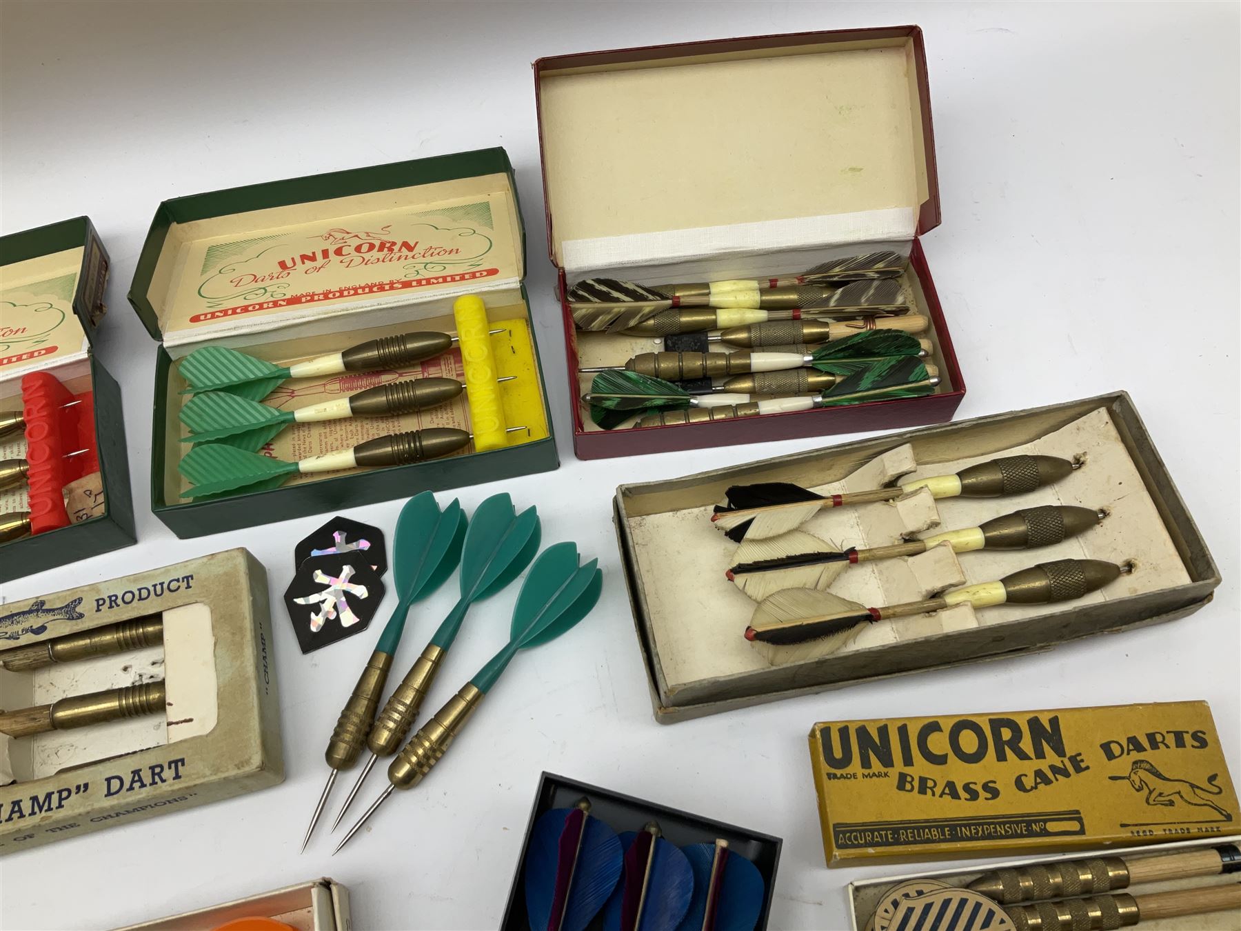 Nineteen sets of dartboard darts by Unicorn, Jim Pike, 'One-o-One', Farebrother etc, with various flights, shafts, styles and weights; predominantly boxed