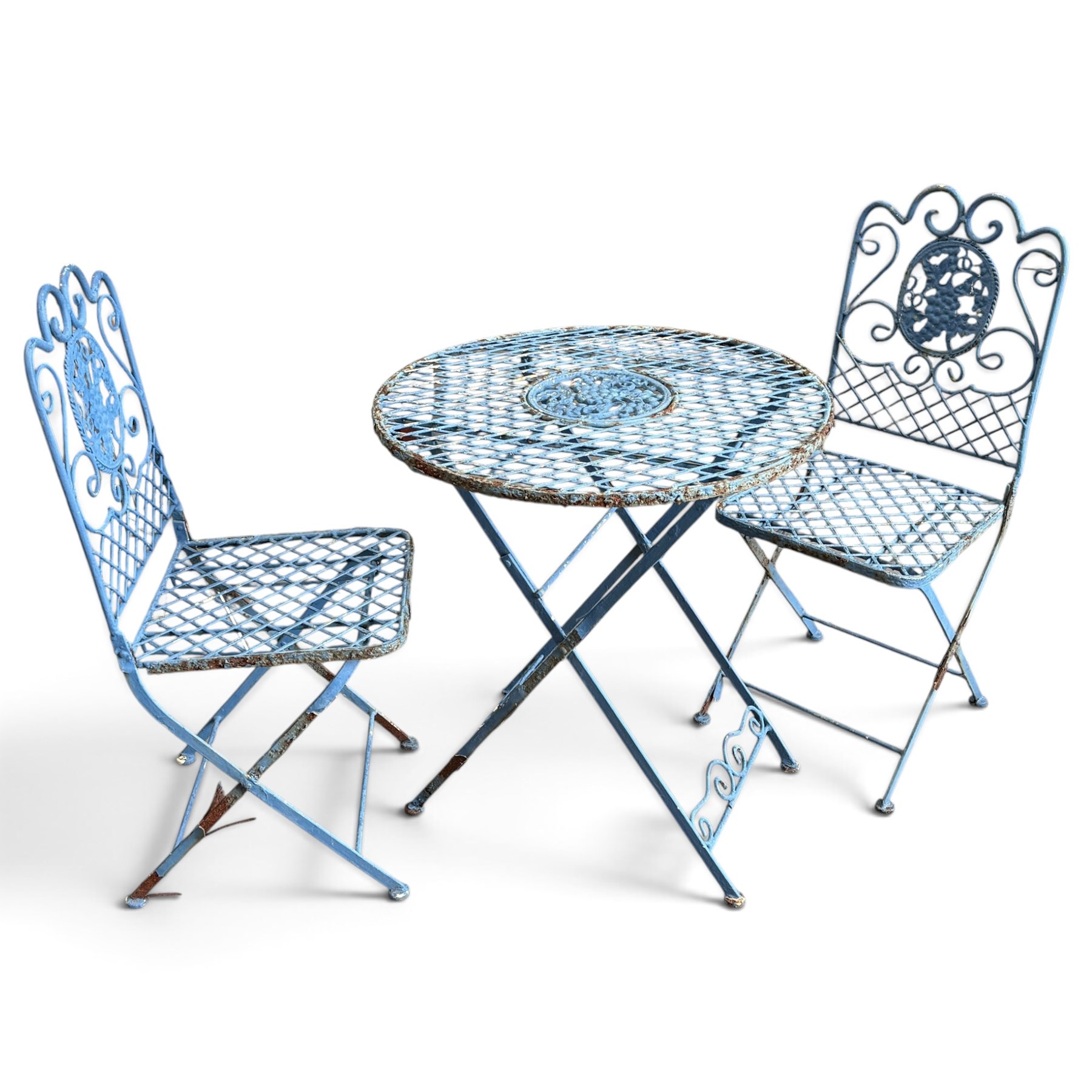 Three-piece French style blue-painted wrought iron garden bistro set, comprising a circular folding table with latticework top and central fruiting grapevine medallion (W71cm H76cm) and matching pair of chairs, with scrolling cresting rail and grapevine motif over folding X-frame base (W40cm H98cm)