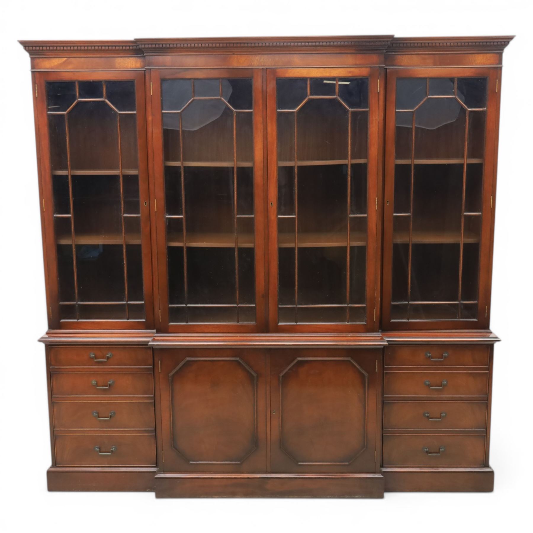 Wade Furniture - Georgian design mahogany breakfront bookcase cabinet, featuring four astragal glazed doors, above eight drawers and two cupboards, one fitted cutlery drawer