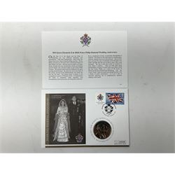Royal Mail stamps including Queen Elizabeth II mint decimal presentation packs, special stamp year books etc, face value of usable postage approximately 500 GBP and a five pound coin cover, housed in four ring binder folders and loose