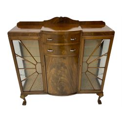 Mid-20th century Art Deco style walnut display cabinet, two central drawers over cupboard flanked by two bevel glazed display cabinets with sunburst astragal glazing, on ball and claw cabriole feet