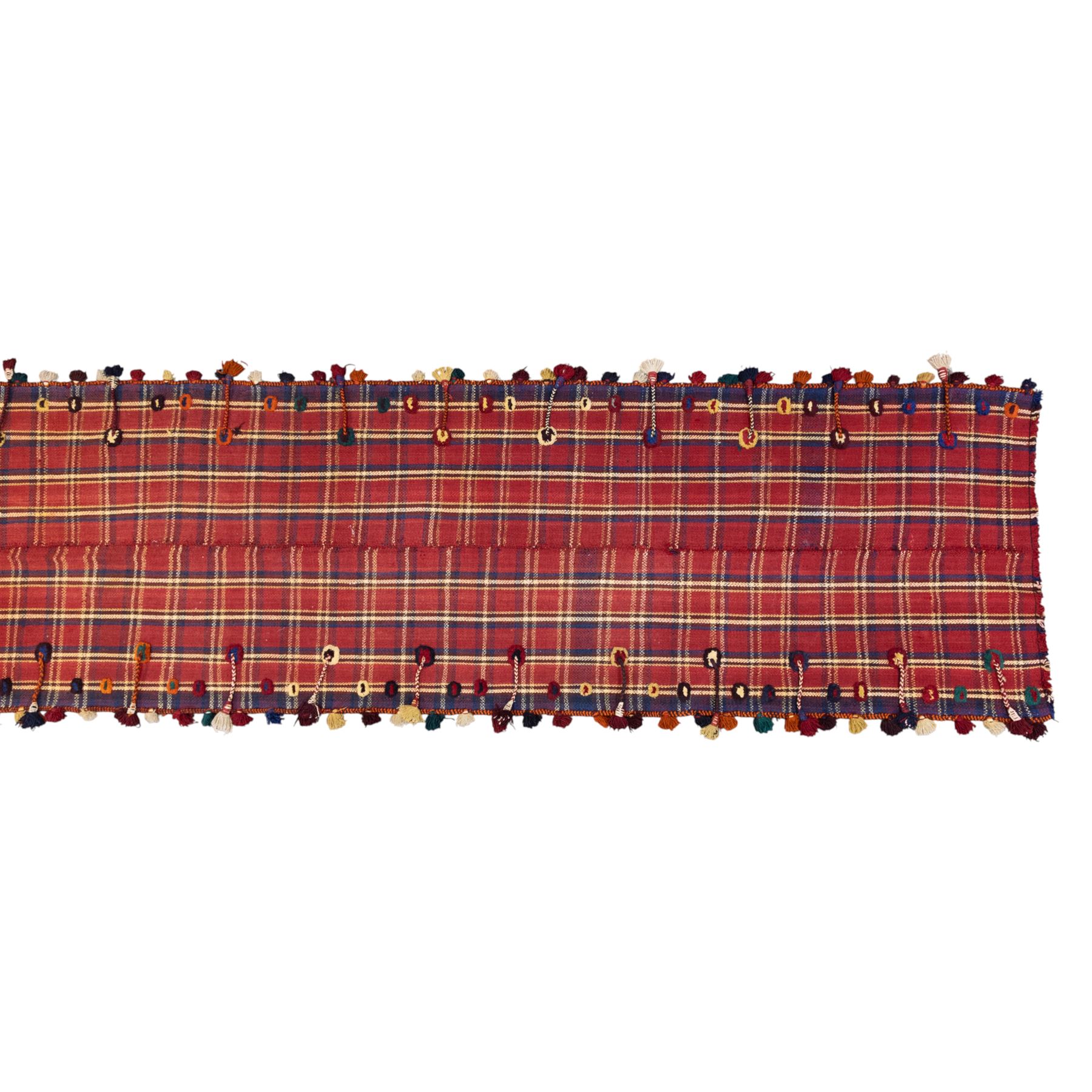 South West Persian Jajim kilim flatweave runner, composed of joined narrow woven bands,  field decorated with checked and striped motifs in shades of madder red, indigo, ivory ochre, and green, sides applied knotted wool tufts and braided elements with tasselled edges, (due to the large size, the runner is illustrated in two sections) 