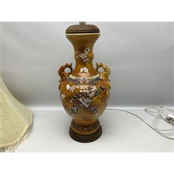 20th century Japanese vase converted to a lamp, the baluster form body decorated with samurai warriors and blossoming branches with twin handles, with wood base and fixtures, with tasselled fabric shade, H56cm excl shade