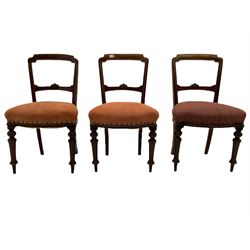 Set six Victorian walnut dining chairs, incised crest rail over floral carved bar back, upholstered seat pads, raised on turned supports W49cm
