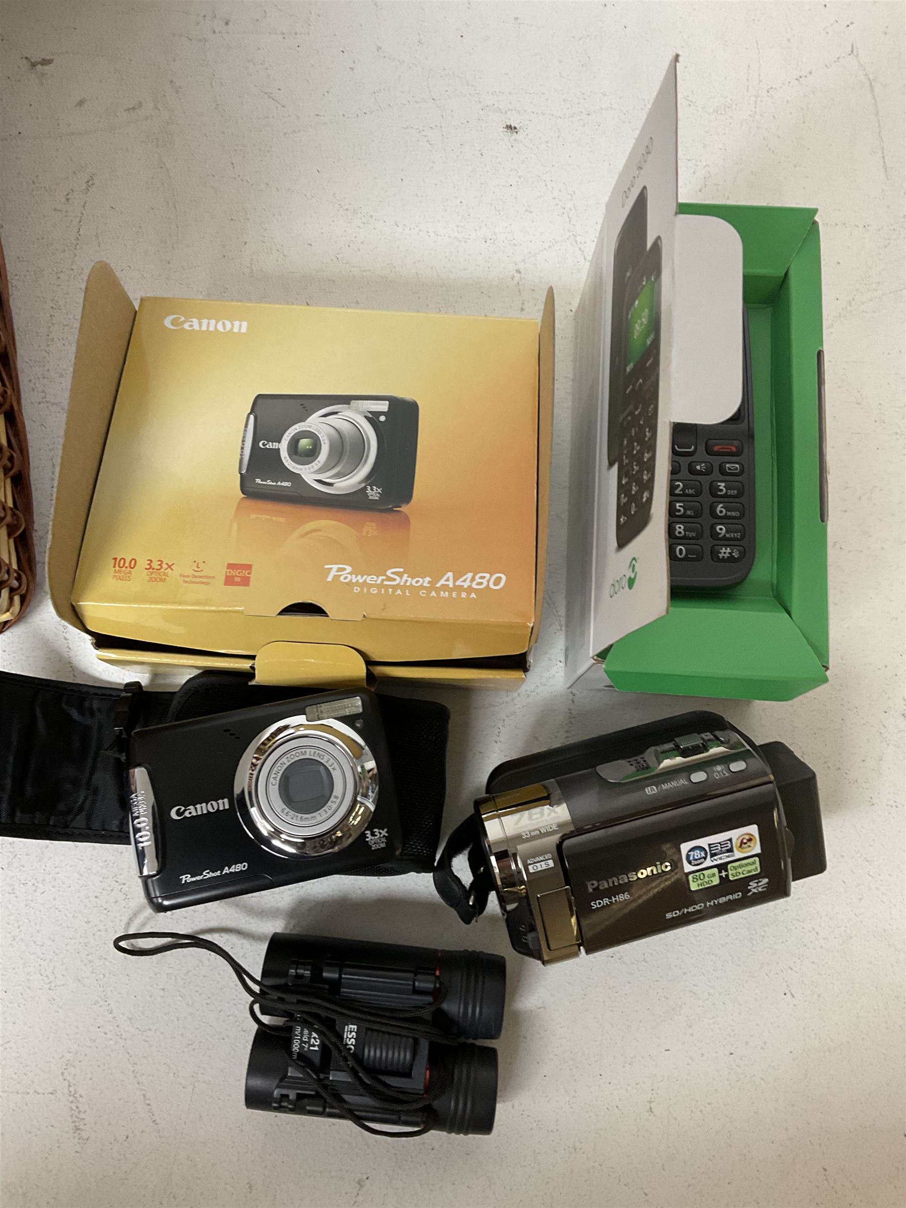 Canon Powershot A480 digital camera, in box, together with a Panasonic SDR-H86 digital video camera, Doro 5030 mobile phone, pair of Jessops Field Binoculars, two Weetabix diecast model cars, wicker picnic basket with plastic picnic ware and a collection of vinyl records