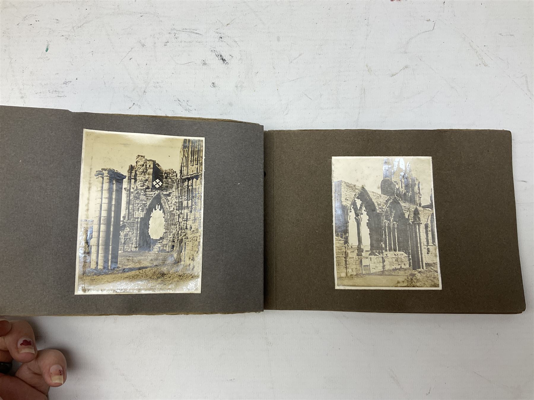 Quantity of books and postcards predominantly of Whitby interest including Hornes' Guide to Whitby 1890 and Hornes' Tourist map of Whitby, A Holiday Tour in and Around Whitby by H.S. Forman 1896 etc