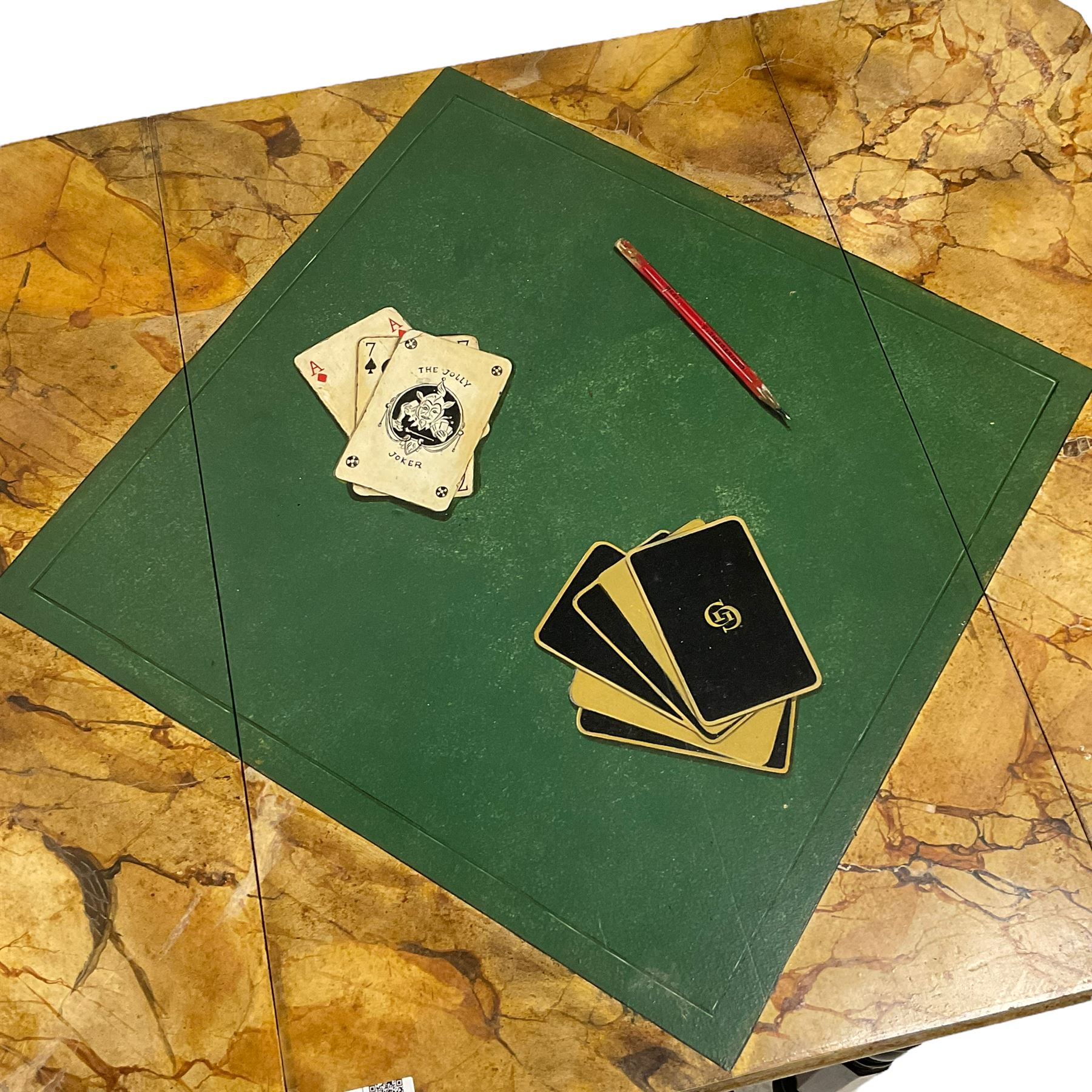 Victorian ebonised drop-leaf pot cupboard with later trompe l'oeil painted top, depicting marbled surface with baize cloth, playing cards and pencil, fitted with two drawers to one end and cupboard to the other with marble inset, on turned and faceted supports with brass castors