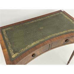 Reproduction Georgian style mahogany writing table, reverse bow front with green leather inset, two frieze drawers, turned and fluted supports 