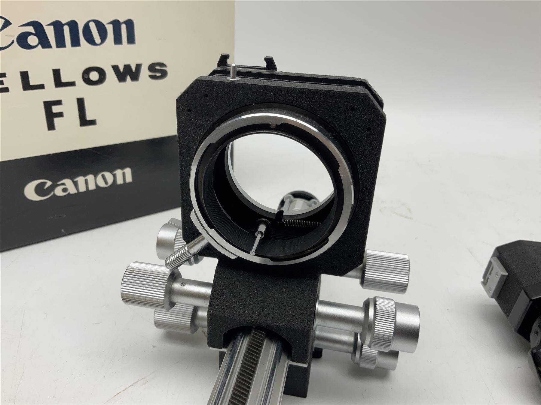 Collection of Canon lenses, to include 'Canon Lens FD 100mm 1:2.8', serial no 12821, 'Canon Lens FD 200mm 1:4' serial no 245313, 'Macro Canon Lens FL 50mm 1:3.5', serial no. 25505, 'Canon Lens FD 135mm 1:3.5 etc, together with other Canon equipment, including Bellows FL, Slide Duplicator etc 