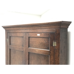  Late 18th century oak double corner cupboard, two long and two short panelled doors enclosing fitted shelves, plinth base, W119cm, H189cm, D68cm  