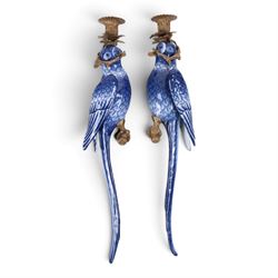 Pair of wall sconces, modelled as blue parrot upon a gilt branch, H47cm