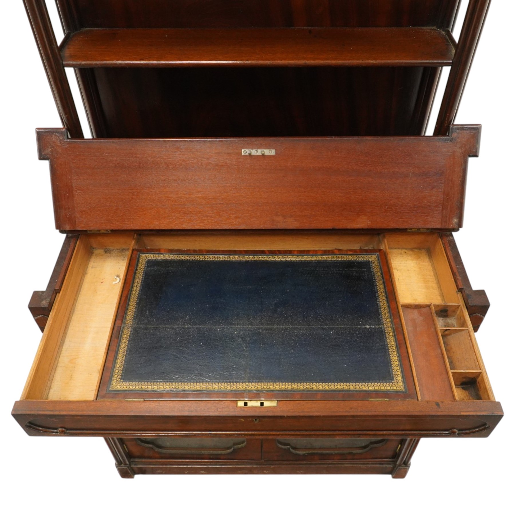 Late 19th century Gothic Inspired secretaire-chiffonier, the raised superstructure with two open shelves and cluster-column uprights, the base fitted with hinged top over secretaire drawer with hinged slope writing surface and pen-rest compartments, over a twin glazed doors enclosing single shelf, the flanking cluster-columns on skirted base